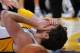 January 6, 2013; Los Angeles, CA, USA; Los Angeles Lakers power forward Pau Gasol (16) lays on the floor after being fouled by Denver Nuggets center JaVale McGee (34) in the second half of the game at the Staples Center. Gasol left the game. Nuggets won 112-105. Mandatory Credit: Jayne Kamin-Oncea-USA TODAY Sports