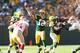 GREEN BAY, WI - SEPTEMBER 09: Aaron Rodgers #12 of the Green Bay Packers throws a pass during the NFL season opener against the San Francisco 49ers at Lambeau Field on September 9, 2012 in Green Bay, Wisconsin. (Photo by Andy Lyons/Getty Images)