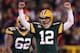 GREEN BAY, WI - JANUARY 05: Quarterback Aaron Rodgers #12 of the Green Bay Packers celebrates after fullback John Kuhn #30 scores on a three-yard touchdown run in the second quarter against the Minnesota Vikings during the NFC Wild Card Playoff game at Lambeau Field on January 5, 2013 in Green Bay, Wisconsin. (Photo by Andy Lyons/Getty Images)