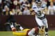 LANDOVER, MD - JANUARY 06: Russell Wilson #3 of the Seattle Seahawks runs the ball during their NFC Wild Card Playoff Game against the Washington Redskins at FedExField on January 6, 2013 in Landover, Maryland. (Photo by Patrick McDermott/Getty Images)