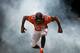 DENVER, CO - DECEMBER 30: Outside linebacker Wesley Woodyard #52 of the Denver Broncos is surrounded by smoke as he emerges from the tunnel before a game against the Kansas City Chiefs at Sports Authority Field at Mile High on December 30, 2012 in Denver, Colorado. The Broncos defeated the Chiefs 38-3. (Photo by Dustin Bradford/Getty Images)