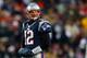 FOXBORO, MA - DECEMBER 30: Tom Brady #12 of the New England Patriots walks to the sideline during a game with the Miami Dolphins at Gillette Stadium in the second quarter on December 30, 2012 in Foxboro, Massachusetts. (Photo by Jim Rogash/Getty Images)