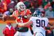 BLACKSBURG, VA - NOVEMBER 24: Quarterback Logan Thomas #3 of the Virginia Tech Hokies throws the ball as defensive end Jake Snyder #90 of the Virginia Cavaliers chases at Lane Stadium on November 24, 2012 in Blacksburg, Virginia. (Photo by Geoff Burke/Getty Images)