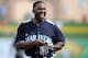 PEORIA, AZ - MARCH 01: Milton Bradley #15 of the Seattle Mariners smiles as he leaves the field against the Texas Rangers during spring training at Peoria Stadium on March 1, 2011 in Peoria, Arizona. (Photo by Harry How/Getty Images)