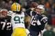 FOXBORO, MA - DECEMBER 19: Quarterback Tom Brady #12 of the New England Patriots throws a touchdown pass to tight end Aaron Hernandez #85 (not pictured) in the fourth quarter of the game against the Green Bay Packers at Gillette Stadium on December 19, 2010 in Foxboro, Massachusetts. (Photo by Elsa/Getty Images)