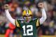 GREEN BAY, WI - JANUARY 05: Quarterback Aaron Rodgers #12 of the Green Bay Packers celebrates after fullback John Kuhn #30 scores on a three-yard touchdown run in the second quarter against the Minnesota Vikings during the NFC Wild Card Playoff game at Lambeau Field on January 5, 2013 in Green Bay, Wisconsin. (Photo by Andy Lyons/Getty Images)