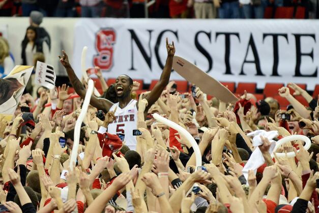 N.C. State Fans Rushing Court After Upset Knocked over Fan in Wheelchair