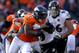 DENVER, CO - JANUARY 12: Knowshon Moreno #27 of the Denver Broncos runs the ball in the first half against Danny Trevathan #59 of the Denver Broncos during the AFC Divisional Playoff Game at Sports Authority Field at Mile High on January 12, 2013 in Denver, Colorado. (Photo by Jeff Gross/Getty Images)