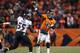 DENVER, CO - JANUARY 12: Peyton Manning #18 of the Denver Broncos throws a pass in in the fourth quarter against Terrell Suggs #55 of the Baltimore Ravens during the AFC Divisional Playoff Game at Sports Authority Field at Mile High on January 12, 2013 in Denver, Colorado. (Photo by Jeff Gross/Getty Images)