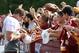 Washington Redskins' fans flock to tight end Chris Cooley during an autograph session at the team's training facility in Virginia.