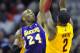 Dec 11, 2012; Cleveland, OH, USA; Los Angeles Lakers shooting guard Kobe Bryant (24) blocks a shot attempt by Cleveland Cavaliers point guard Kyrie Irving (2) in the third quarter at Quicken Loans Arena. Mandatory Credit: David Richard-USA TODAY Sports