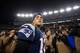 FOXBORO, MA - JANUARY 13: Tom Brady #12 of the New England Patriots walks on the field after defeating the Houston Texans by a score of 41-28 to win the 2013 AFC Divisional Playoffs game at Gillette Stadium on January 13, 2013 in Foxboro, Massachusetts. (Photo by Elsa/Getty Images)