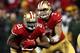 SAN FRANCISCO, CA - JANUARY 12: Quarterback Colin Kaepernick #7 of the San Francisco 49ers hands the ball to running back Frank Gore #21 against the Green Bay Packers during the NFC Divisional Playoff Game at Candlestick Park on January 12, 2013 in San Francisco, California. (Photo by Stephen Dunn/Getty Images)