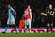 Vincent Kompany trudges off the field at Arsenal following his dismissal by referee Mike Dean.