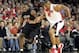 LOUISVILLE, KY - FEBRUARY 2: Jason Maxiell #54 of the Cincinnati Bearcats dribbles against Ellis Myles #2 of the Louisville Cardinals during the game on February 2, 2005 at Freedom Hall in Louisville, Kentucky. Louisville won the game 77-70. (Photo by Andy Lyons/Getty Images)