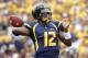 PITTSBURGH, PA - SEPTEMBER 01: Geno Smith #12 of the West Virginia Mountaineers drops back to pass against the Marshall Thundering Herd during the game on September 1, 2012 at Mountaineer Field in Morgantown, West Virginia. (Photo by Justin K. Aller/Getty Images)