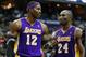 December 14, 2012; Washington, DC, USA; Los Angeles Lakers shooting guard Kobe Bryant (24) and Lakers center Dwight Howard (12) talk on the court against the Washington Wizards in the fourth quarter at Verizon Center. The Lakers won 102-96. Mandatory Credit: Geoff Burke-USA TODAY Sports