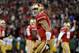 SAN FRANCISCO, CA - JANUARY 12: Quarterback Colin Kaepernick #7 of the San Francisco 49ers celebrates a touchdown against the Green Bay Packers during the NFC Divisional Playoff Game at Candlestick Park on January 12, 2013 in San Francisco, California. (Photo by Harry How/Getty Images)