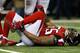 John Abraham Grabs at his Sprained Ankle
