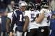 Jan 22, 2012; Foxborough, MA, USA; New England Patriots quarterback Tom Brady (12) exchanges words with Baltimore Ravens inside linebacker Ray Lewis (52) during the third quarter in the 2011 AFC Championship game at Gillette Stadium. Mandatory Credit: Mark L. Baer-USA TODAY Sports