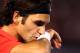 MELBOURNE, AUSTRALIA - JANUARY 26: Roger Federer of Switzerland wipes his face n in his semifinal match against Rafael Nadal of Spain during day eleven of the 2012 Australian Open at Melbourne Park on January 26, 2012 in Melbourne, Australia. (Photo by Clive Brunskill/Getty Images)