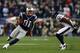 FOXBORO, MA - JANUARY 13: Aaron Hernandez #81 of the New England Patriots runs with the ball against Danieal Manning #38 of the Houston Texans during the 2013 AFC Divisional Playoffs game at Gillette Stadium on January 13, 2013 in Foxboro, Massachusetts. (Photo by Elsa/Getty Images)