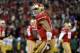 SAN FRANCISCO, CA - JANUARY 12: Quarterback Colin Kaepernick #7 of the San Francisco 49ers celebrates a touchdown against the Green Bay Packers during the NFC Divisional Playoff Game at Candlestick Park on January 12, 2013 in San Francisco, California. (Photo by Harry How/Getty Images)