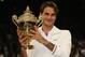 LONDON, ENGLAND - JULY 08: Roger Federer of Switzerland holds up the winner's trophy after winning his Gentlemen's Singles final match against Andy Murray of Great Britain on day thirteen of the Wimbledon Lawn Tennis Championships at the All England Lawn Tennis and Croquet Club on July 8, 2012 in London, England. (Photo by Clive Brunskill/Getty Images)