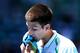 MELBOURNE, AUSTRALIA - JANUARY 14: Novak Djokovic of Serbia wipes his face in his first round match against Paul-Henri Mathieu of France during day one of the 2013 Australian Open at Melbourne Park on January 14, 2013 in Melbourne, Australia. (Photo by Michael Dodge/Getty Images)