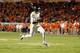 MIAMI GARDENS, FL - JANUARY 04: Geno Smith #12 of the West Virginia Mountaineers scores a 7-yard rushing touchdown in the second quarter against the Clemson Tigers during the Discover Orange Bowl at Sun Life Stadium on January 4, 2012 in Miami Gardens, Florida. (Photo by Streeter Lecka/Getty Images)