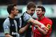 LONDON, ENGLAND - JANUARY 12: Scott Parker (L) and Michael Dawson (C) of Tottenham Hotspur appeal to match referee Lee Probert (R) during the Barclays Premier League match between Queens Park Rangers and Tottenham Hotspur at Loftus Road on January 12, 2013 in London, England. (Photo by Clive Rose/Getty Images)