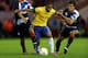 MIDDLESBROUGH, ENGLAND - JULY 20: Lucas of Brazil holds off Aaron Ramsey and Jack Cork of GB during the international friendly match between Team GB and Brazil at Riverside Stadium on July 20, 2012 in Middlesbrough, England. (Photo by Julian Finney/Getty Images)