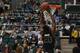 Ricardo Johnson goes up for a dunk in the win over NIU. (Photo by Mark Clavin)