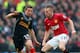 MANCHESTER, ENGLAND - JANUARY 13: Tom Cleverley of Manchester United competes with Joe Allen of Liverpool during the Barclays Premier League match between Manchester United and Liverpool at Old Trafford on January 13, 2013 in Manchester, England. (Photo by Alex Livesey/Getty Images)