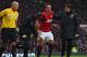 MANCHESTER, ENGLAND - JANUARY 13: Nemanja Vidic of Manchester United is helped off during the Barclays Premier League match between Manchester United and Liverpool at Old Trafford on January 13, 2013 in Manchester, England. (Photo by Alex Livesey/Getty Images)