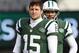 EAST RUTHERFORD, NJ - DECEMBER 23: Quarterbacks Tim Tebow #15 and Mark Sanchez #6, look on as teammate Greg McElroy #14 of the New York Jets passes before the start of their game against the San Diego Chargers at MetLife Stadium on December 23, 2012 in East Rutherford, New Jersey. (Photo by Rich Schultz/Getty Images)
