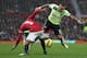 MANCHESTER, ENGLAND - DECEMBER 26: Danny Simpson of Newcastle United is tackled by Patrice Evra of Manchester United during the Barclays Premier League match between Manchester United and Newcastle United at Old Trafford December 26, 2012 in Manchester, England. (Photo by Clive Brunskill/Getty Images)