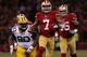SAN FRANCISCO, CA - JANUARY 12: Quarterback Colin Kaepernick #7 of the San Francisco 49ers runs the ball against nose tackle B.J. Raji #90 of the Green Bay Packers during the NFC Divisional Playoff Game at Candlestick Park on January 12, 2013 in San Francisco, California. (Photo by Stephen Dunn/Getty Images)
