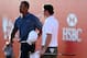 ABU DHABI, UNITED ARAB EMIRATES - JANUARY 18: Tiger Woods of the USA and Rory McIlroy of Northern Ireland on the 18th green during the second round of the Abu Dhabi HSBC Golf Championship at the Abu Dhabi Golf Club on January 18, 2013 in Abu Dhabi, United Arab Emirates. (Photo by Ross Kinnaird/Getty Images)