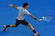 MELBOURNE, AUSTRALIA - JANUARY 17: Roger Federer of Switzerland plays a backhand in his second round match against Nikolay Davydenko of Russia during day four of the 2013 Australian Open at Melbourne Park on January 17, 2013 in Melbourne, Australia. (Photo by Quinn Rooney/Getty Images)