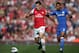 LONDON, ENGLAND - SEPTEMBER 29: Arsenal's Aaron Ramsey and Chelsea's Ashley Cole compete for the ball during the Barclay's Premier League match between Arsenal and Chelsea at the Emirates Stadium on September 29, 2012 in London, England. (Photo by Richard Heathcote/Getty Images)
