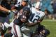 Defensive tackle Henry Melton sacks 2012 first overall pick Andrew Luck.