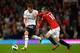 MANCHESTER, ENGLAND - SEPTEMBER 29: Gylfi Sigurdsson of Tottenham Hotspur and Wayne Rooney of Manchester United battle for the ball during the Barclays Premier League match between Manchester United and Tottenham Hotspur at Old Trafford on September 29, 2012 in Manchester, England. (Photo by Shaun Botterill/Getty Images)