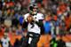 DENVER, CO - JANUARY 12: Quarterback Joe Flacco #5 of the Baltimore Ravens looks to pass against the Denver Broncos during the AFC Divisional Playoff Game at Sports Authority Field at Mile High on January 12, 2013 in Denver, Colorado. The Ravens won 38-35 in 2 overtimes. (Photo by Dustin Bradford/Getty Images)