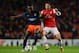 LONDON, ENGLAND - NOVEMBER 21: Mapou Yanga-mbiwa of Montpellier clashes with Mikel Arteta of Arsenal during the UEFA Champions League group B match between Arsenal FC and Montpellier Herault SC at Emirates Stadium on November 21, 2012 in London, England. (Photo by Mike Hewitt/Getty Images)