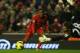 LIVERPOOL, ENGLAND - JANUARY 19: Raheem Sterling of Liverpool shoots past past keeper Mark Bunn of Norwich City prior to Elliott Bennett scoring an own goal during the Barclays Premier League match between Liverpool and Norwich City at Anfield on January 19, 2013 in Liverpool, England. (Photo by Mark Thompson/Getty Images)