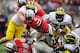 COLUMBUS, OH - NOVEMBER 24: Quarterback Braxton Miller #5 of the Ohio State Buckeyes picks up additional yardage as Craig Roh #88 of the Michigan Wolverines and Thomas Gordon #30 of the Michigan Wolverines make the tackle at Ohio Stadium on November 24, 2012 in Columbus, Ohio. Ohio State defeated Michigan 26-21. (Photo by Jamie Sabau/Getty Images)