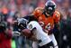 DENVER, CO - JANUARY 12: Torrey Smith #82 of the Baltimore Ravens can't make the catch on a pass as he is defended by Champ Bailey #24 of the Denver Broncos in the second quarter during the AFC Divisional Playoff Game at Sports Authority Field at Mile High on January 12, 2013 in Denver, Colorado. (Photo by Jeff Gross/Getty Images)