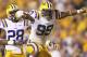 BATON ROUGE, LA - OCTOBER 13: Sam Montgomery #99 of the LSU Tigers celebrates after making a sack on Connor Shaw #14 of the South Carolina Gamecocks in the fourth quarter at Tiger Stadium on October 13, 2012 in Baton Rouge, Louisiana. (Photo by Ronald Martinez/Getty Images)