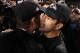 BALTIMORE, MD - NOVEMBER 24: Head coach Jim Harbaugh of the San Francisco 49ers (L) hugs his brother head coach John Harbaugh of the Baltimore Ravens (R) after the Ravens defeated the 49ers 16-6 at M&T Bank Stadium on November 24, 2011 in Baltimore, Maryland. (Photo by Rob Carr/Getty Images)